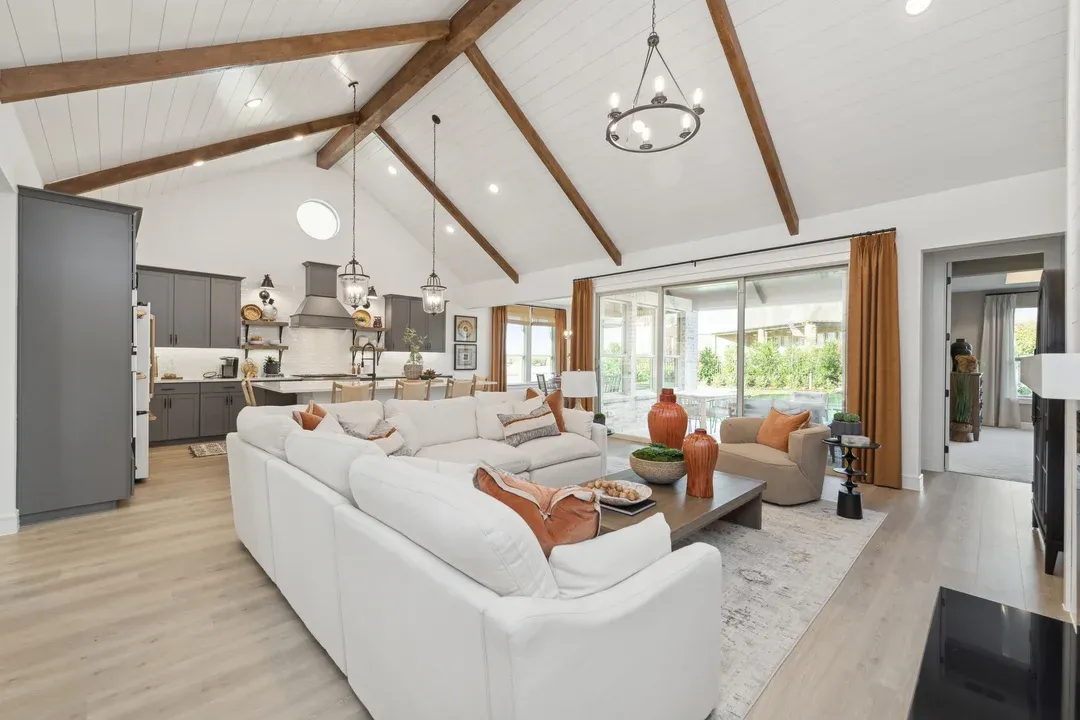 Great room with stained ceiling beams and vaulted ceiling