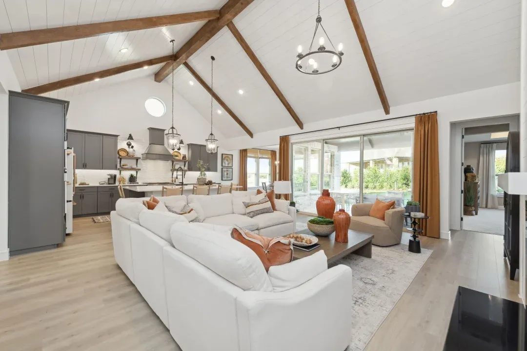 Great room with stained ceiling beams and vaulted ceiling