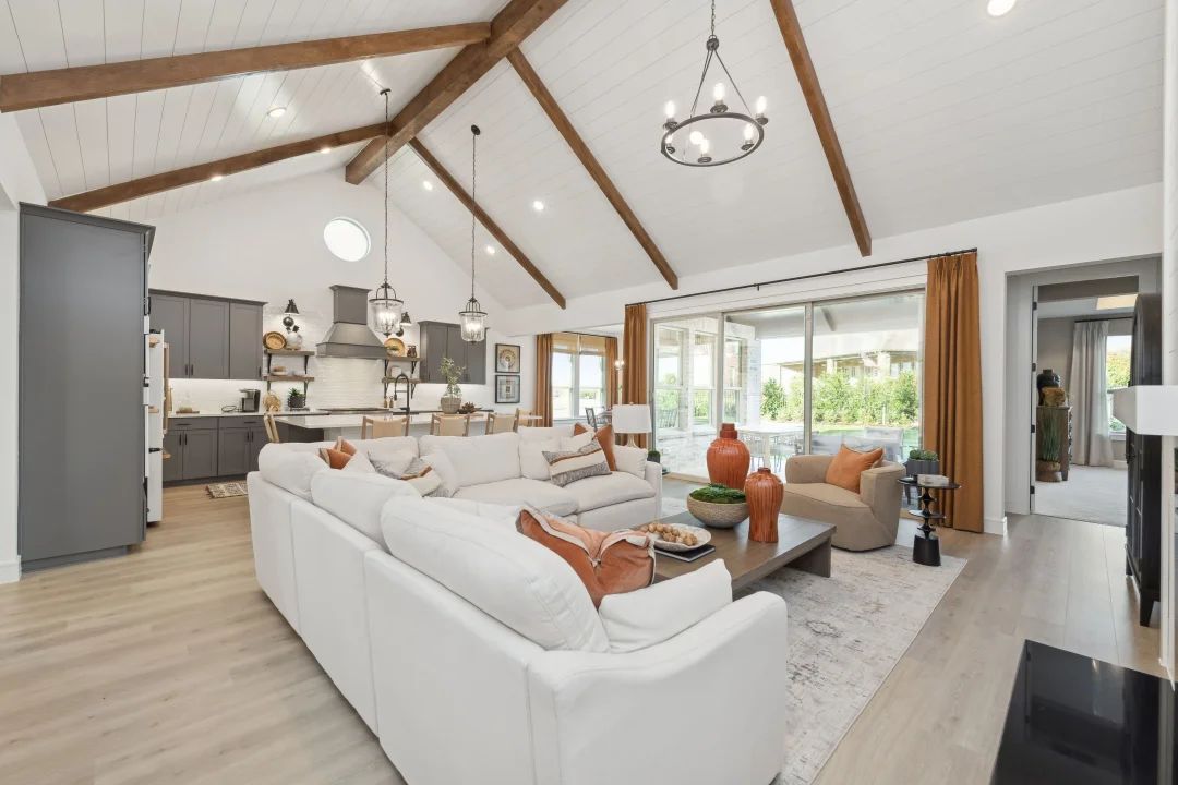Great room with stained ceiling beams and vaulted ceiling