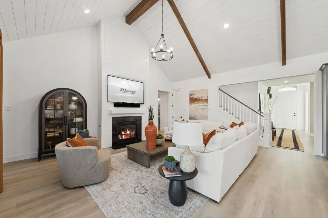 Great room with stained ceiling beams and vaulted ceiling