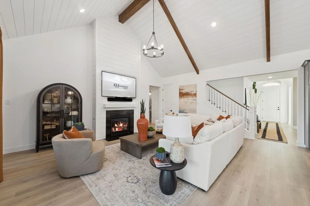 Great room with stained ceiling beams and vaulted ceiling