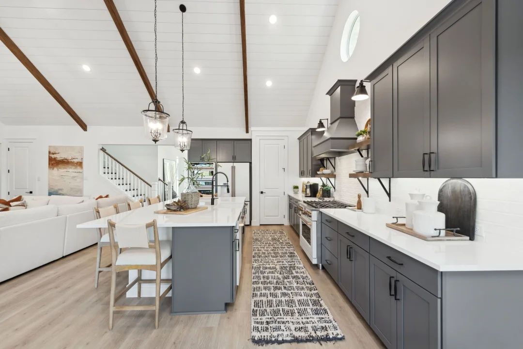 Kitchen with vaulted ceiling and pendant lighting
