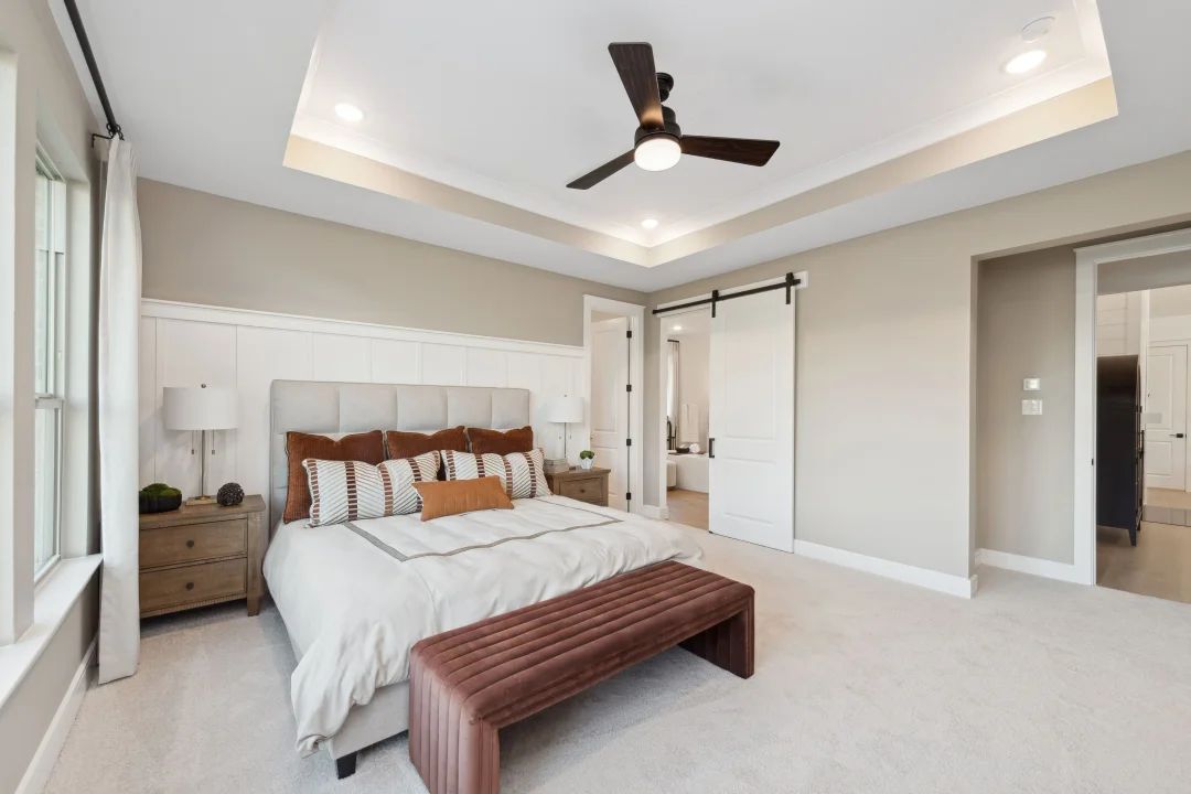 Primary suite with decorative feature wall