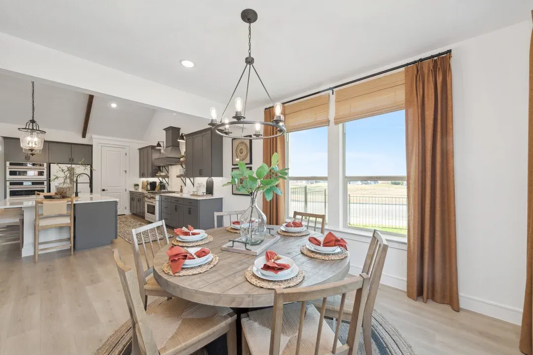 Dining area with chandelier overlooking kitchen