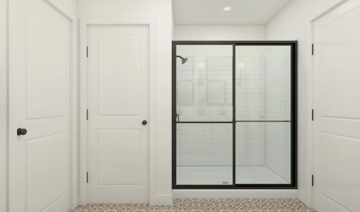 Primary bath with glass-shower enclosure