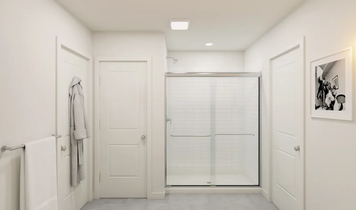 Primary bath with chrome shower enclosure