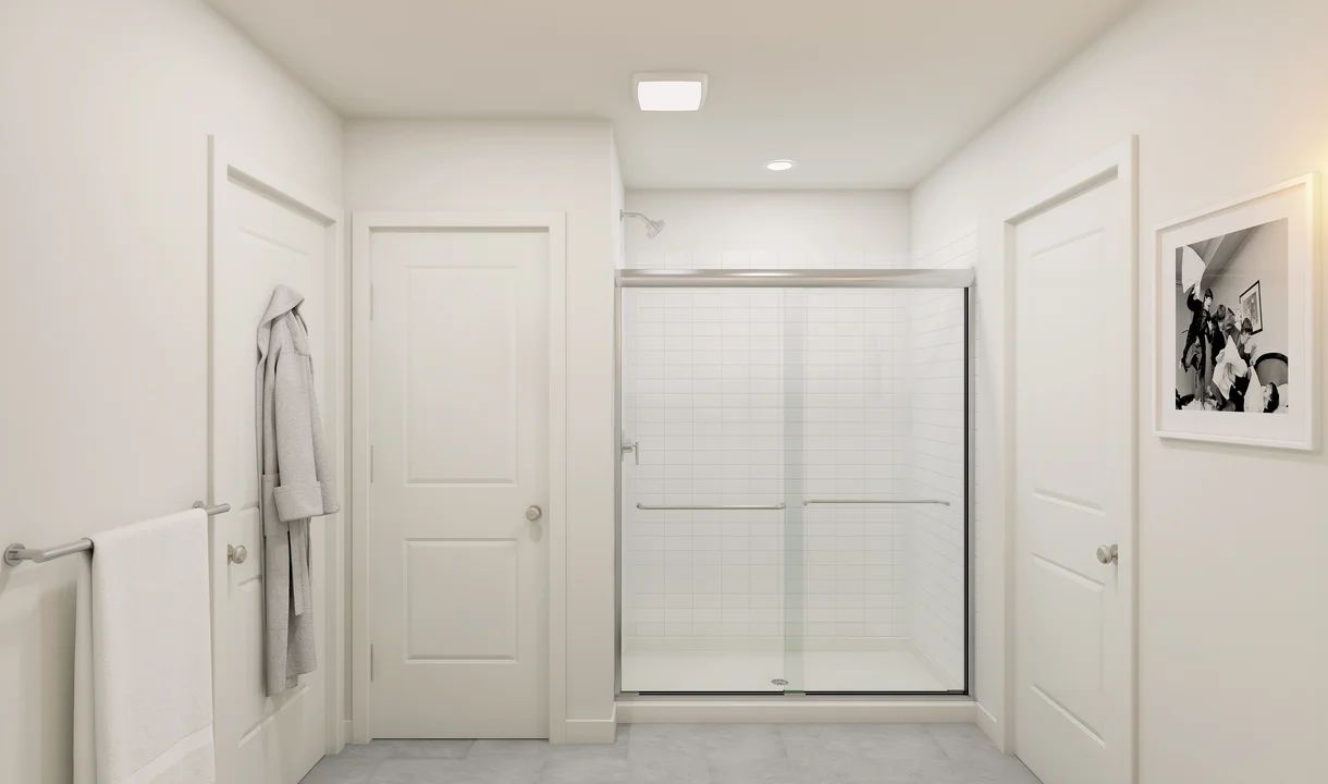 Primary bath with chrome shower enclosure