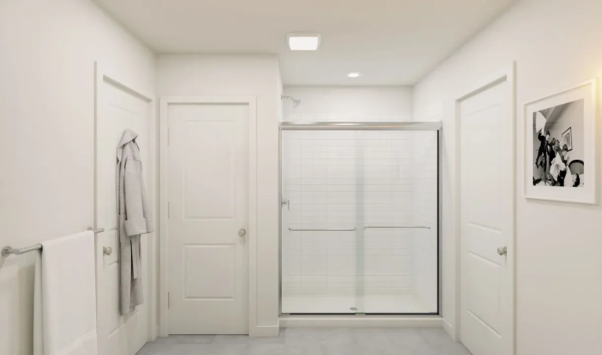 Primary bath with chrome shower enclosure