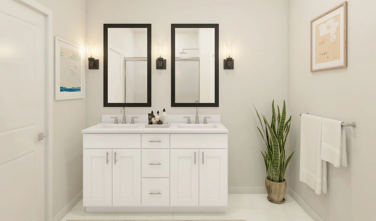Primary bath with black-framed mirrors