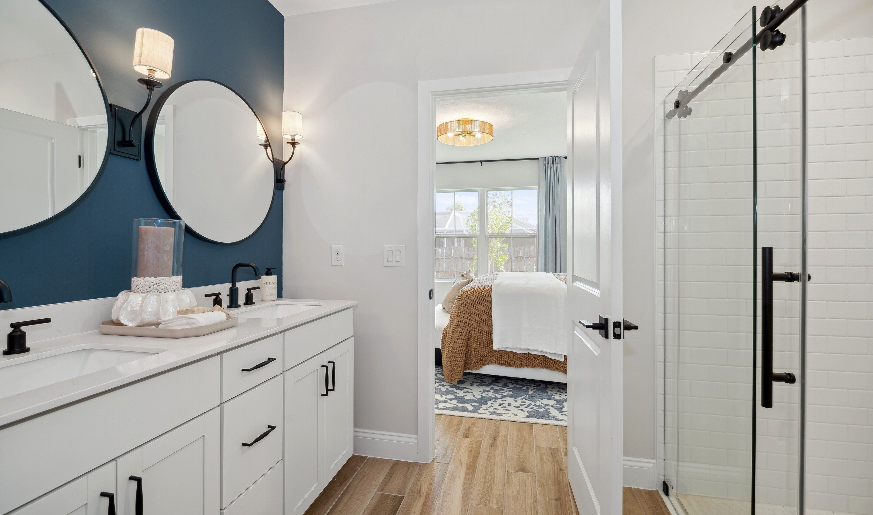 Primary bath with glass shower and matte black fixtures