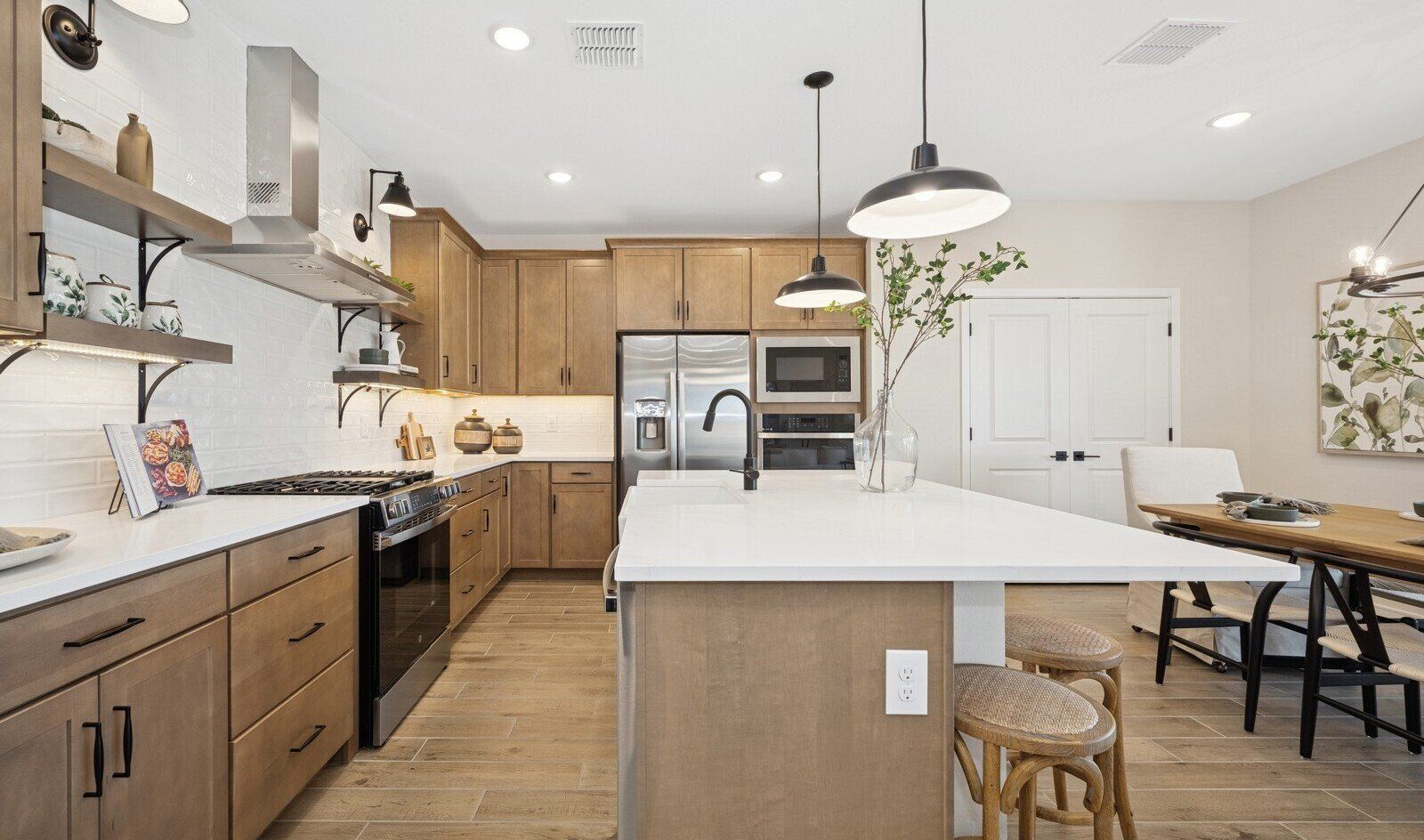 Kitchen with floating shelves and pendant lights
