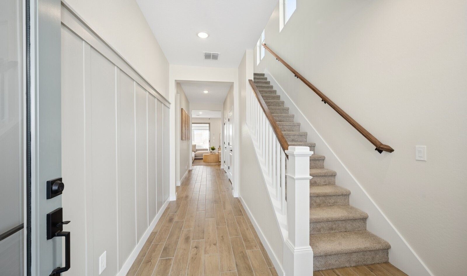 Welcoming foyer with decorative feature wall