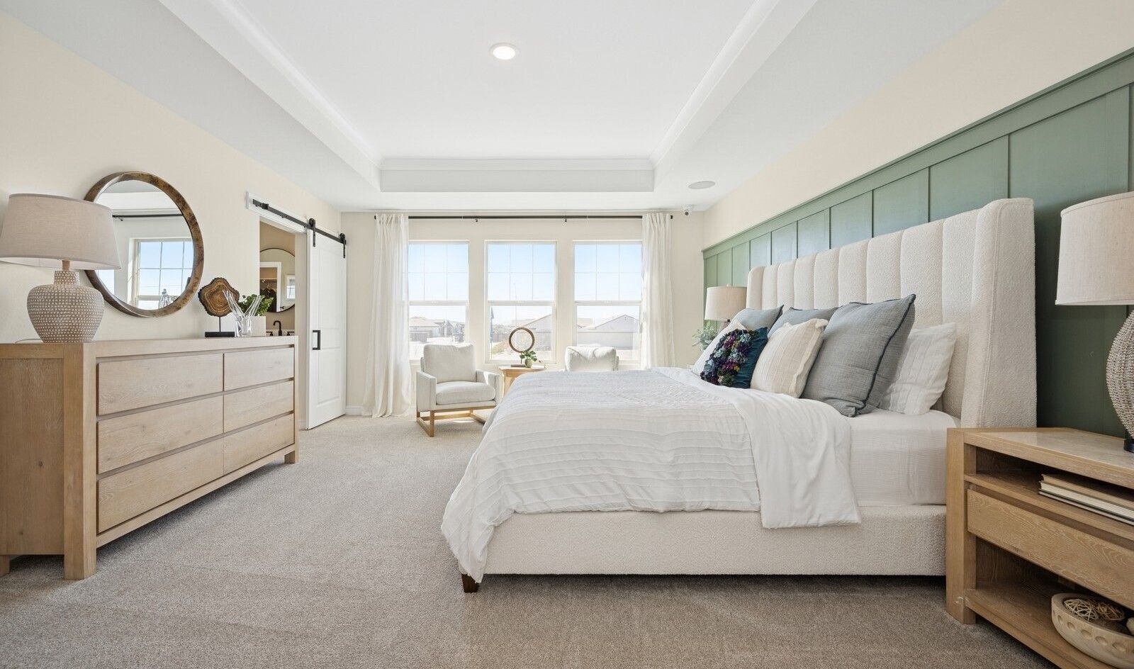 Primary suite with decorative feature wall