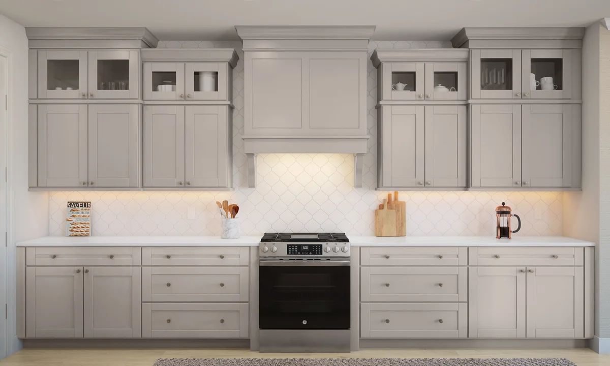 Kitchen with stainless steel appliances and glass upper cabinets