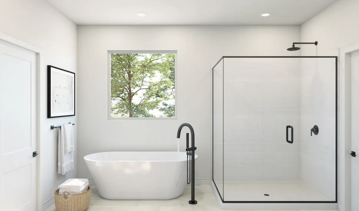 Primary bath with freestanding vanity and glass shower enclosure
