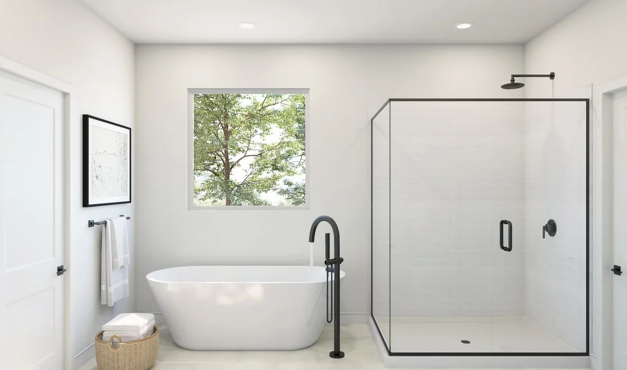 Primary bath with freestanding vanity and glass shower enclosure