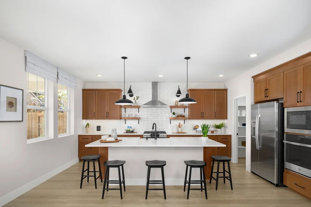 Kitchen with floating shelves and subway tile backsplash