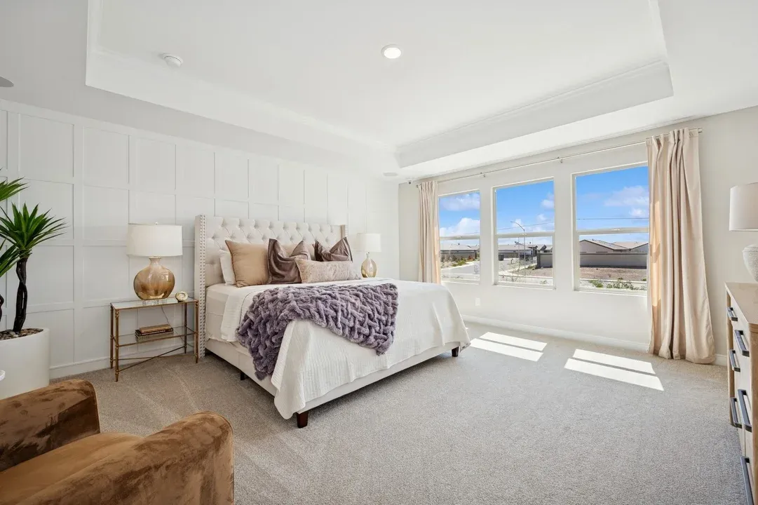 Primary suite with decorative feature wall