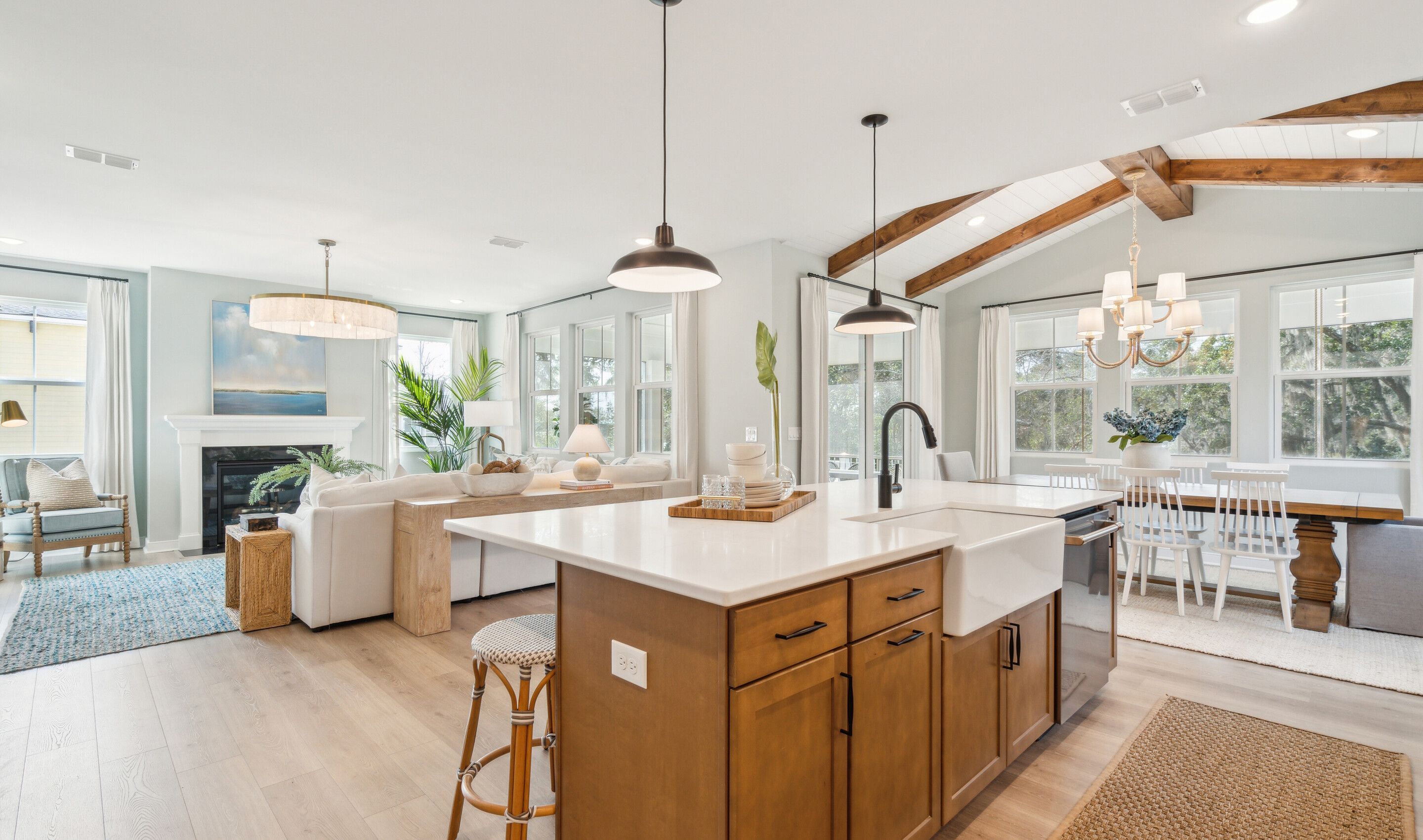 Dining area with stained ceiling beams & vaulted ceiling