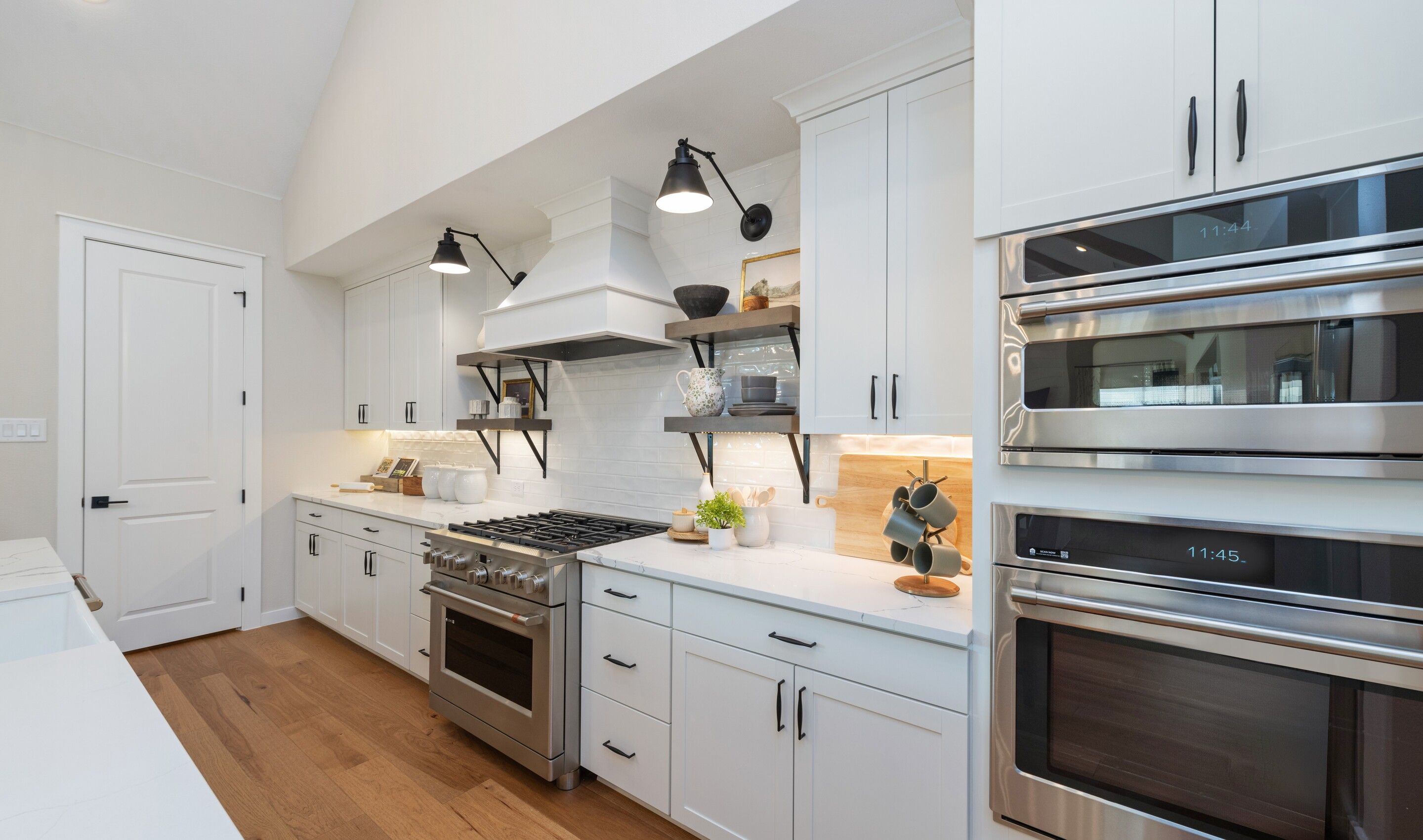 Kitchen with matte black fixtures and gorgeous white backsplash