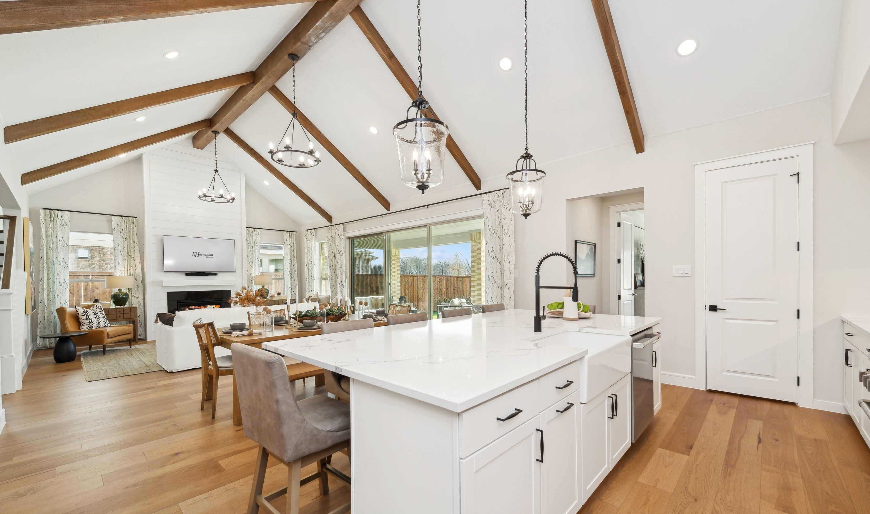 Kitchen with vaulted ceiling and stained ceiling beams