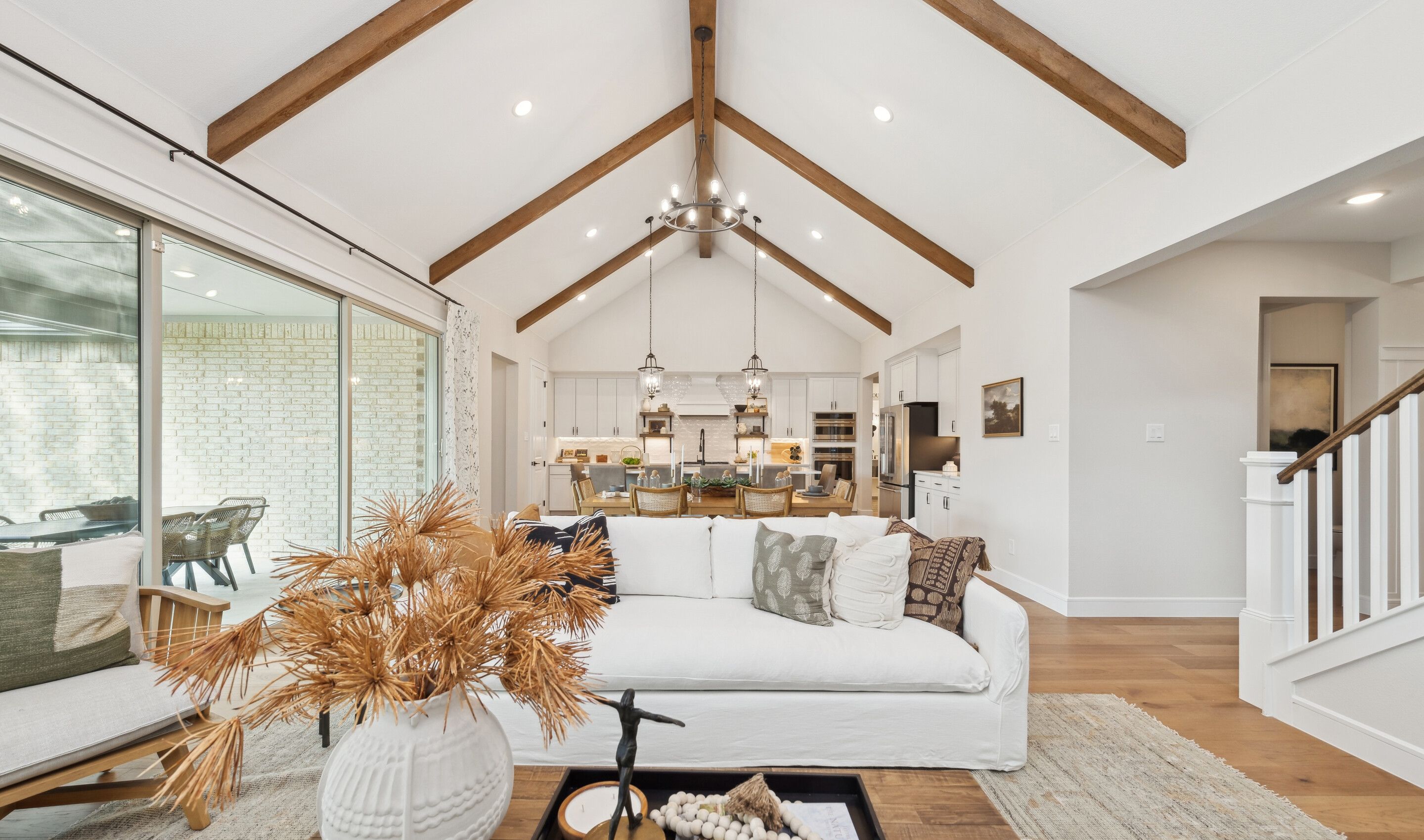 Great room with high ceilings and stained ceiling beams