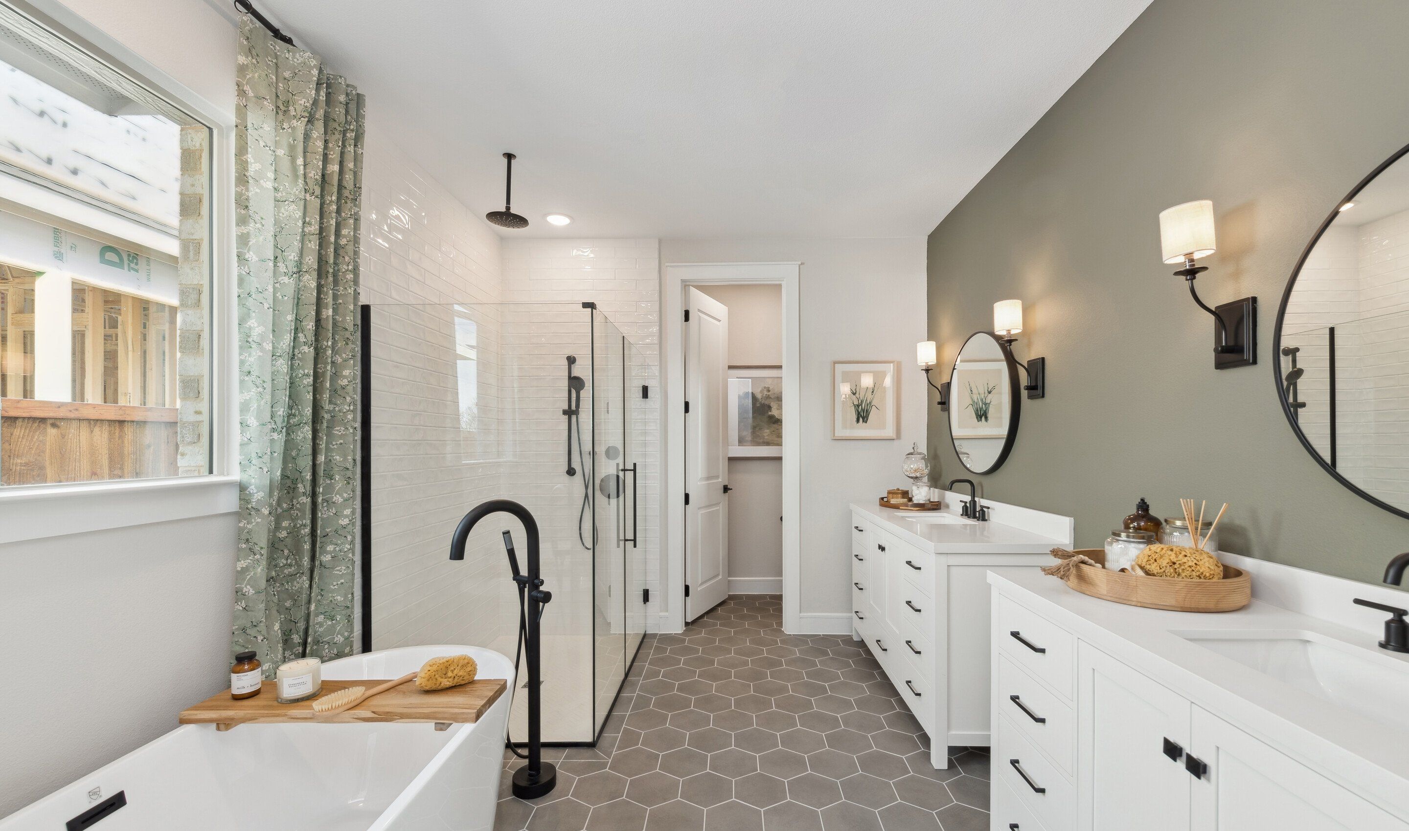 Primary bath with freestanding tub and dual vanities
