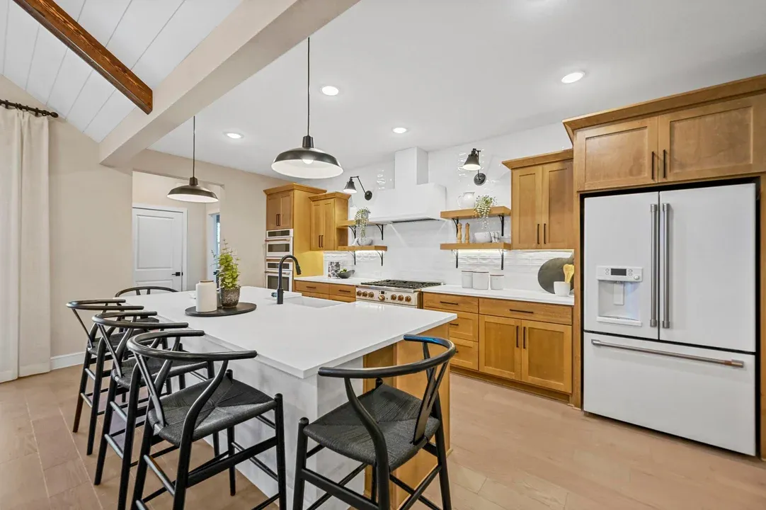 Kitchen with floating shelves and matte black fixtures