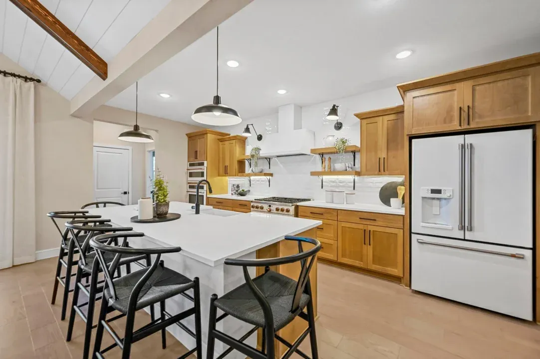 Kitchen with floating shelves and matte black fixtures