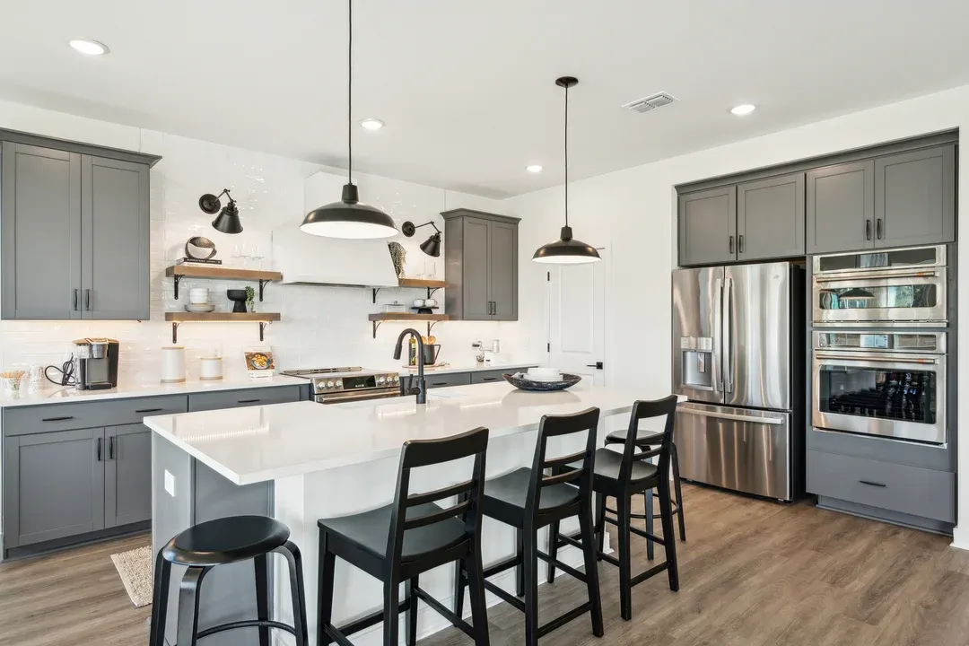 Kitchen with vast island and pendant lights