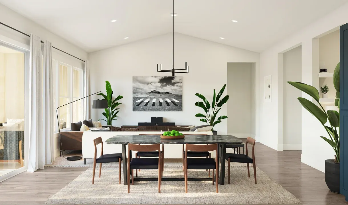 Dining area with vaulted ceiling and chandelier