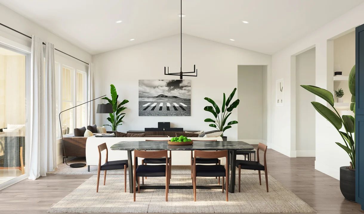 Dining area with vaulted ceiling and chandelier