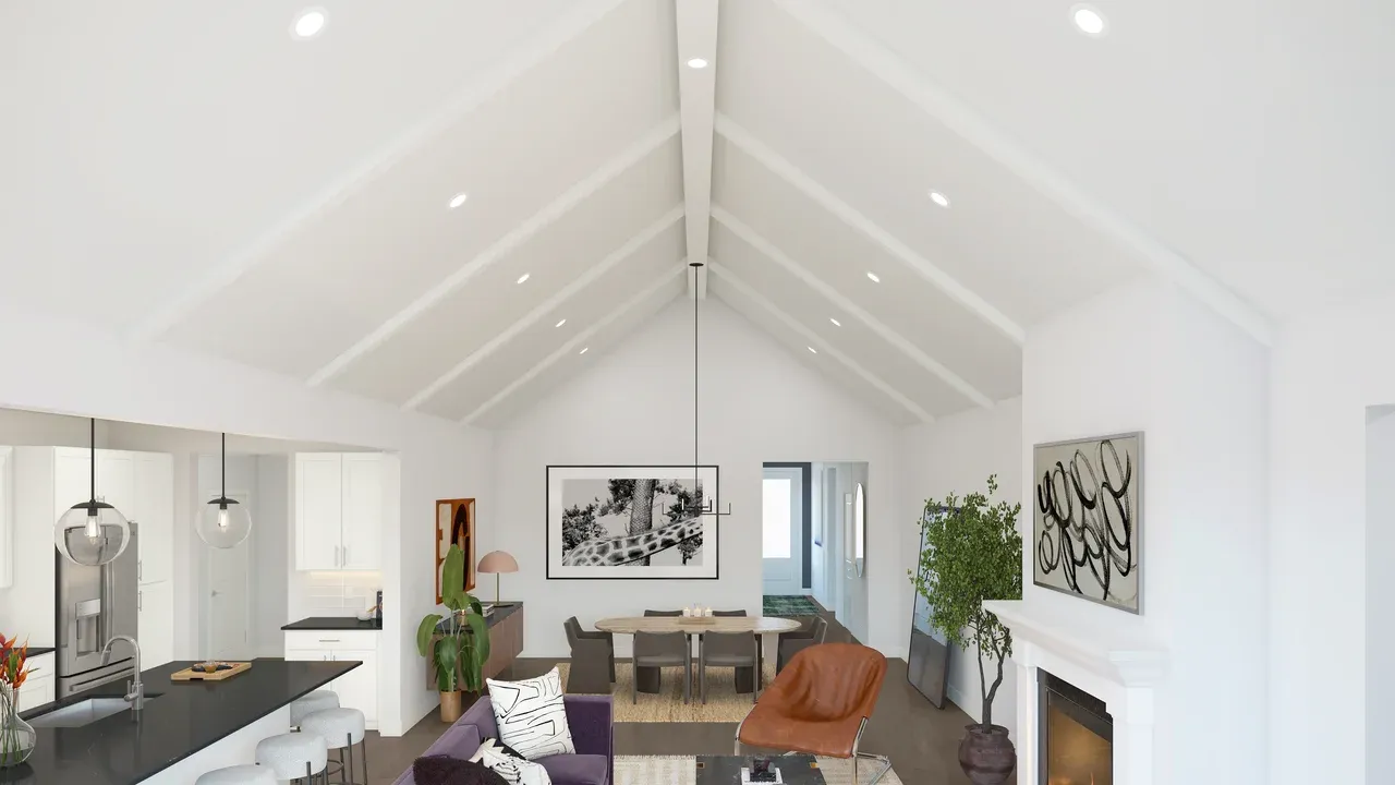 Vaulted ceiling with white-painted ceiling beams and fireplace