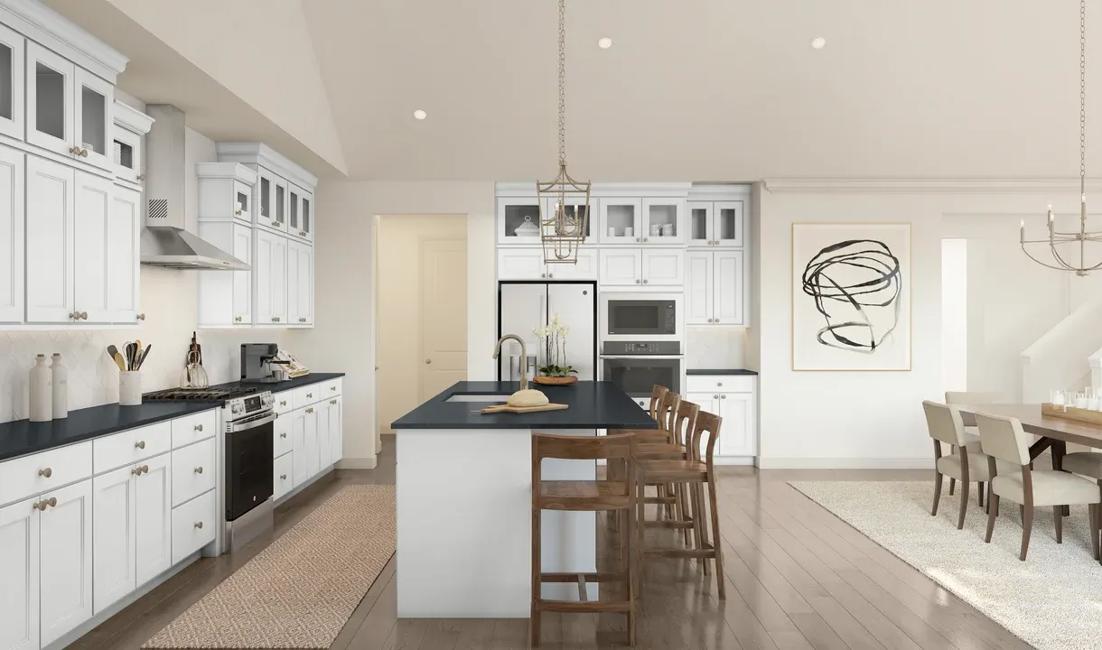 Pendant lighting and gorgeous countertops in kitchen