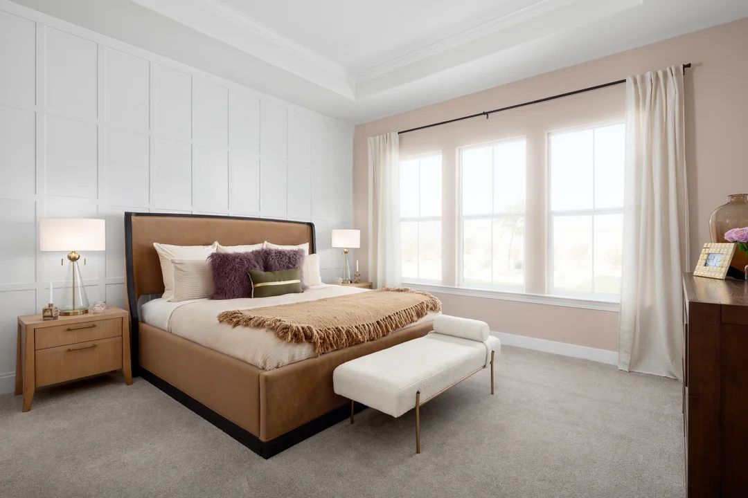 Primary suite with decorative feature wall