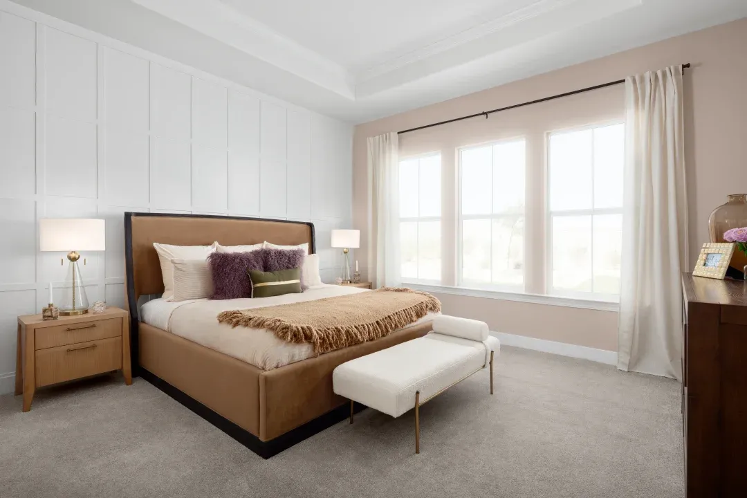 Primary suite with decorative feature wall