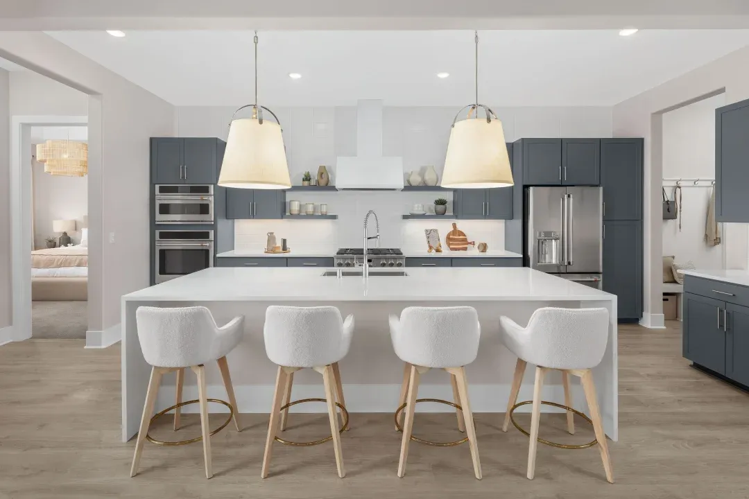 Kitchen with pendant lighting and floating shelves