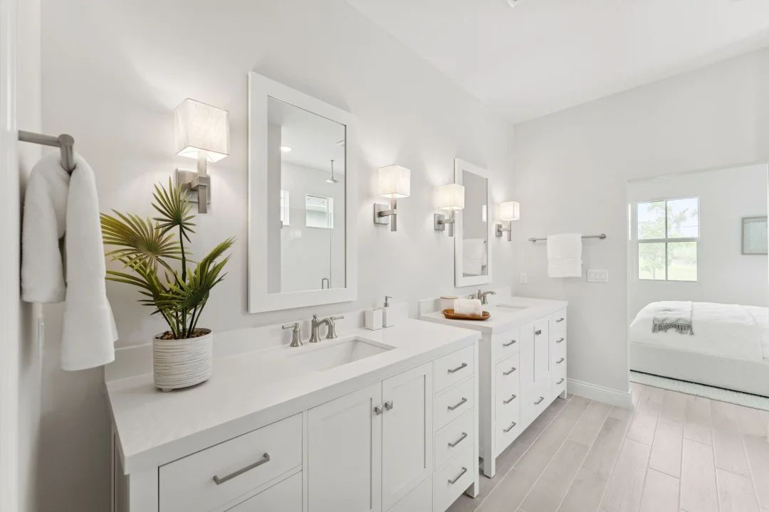 Primary bath with dual freestanding vanities