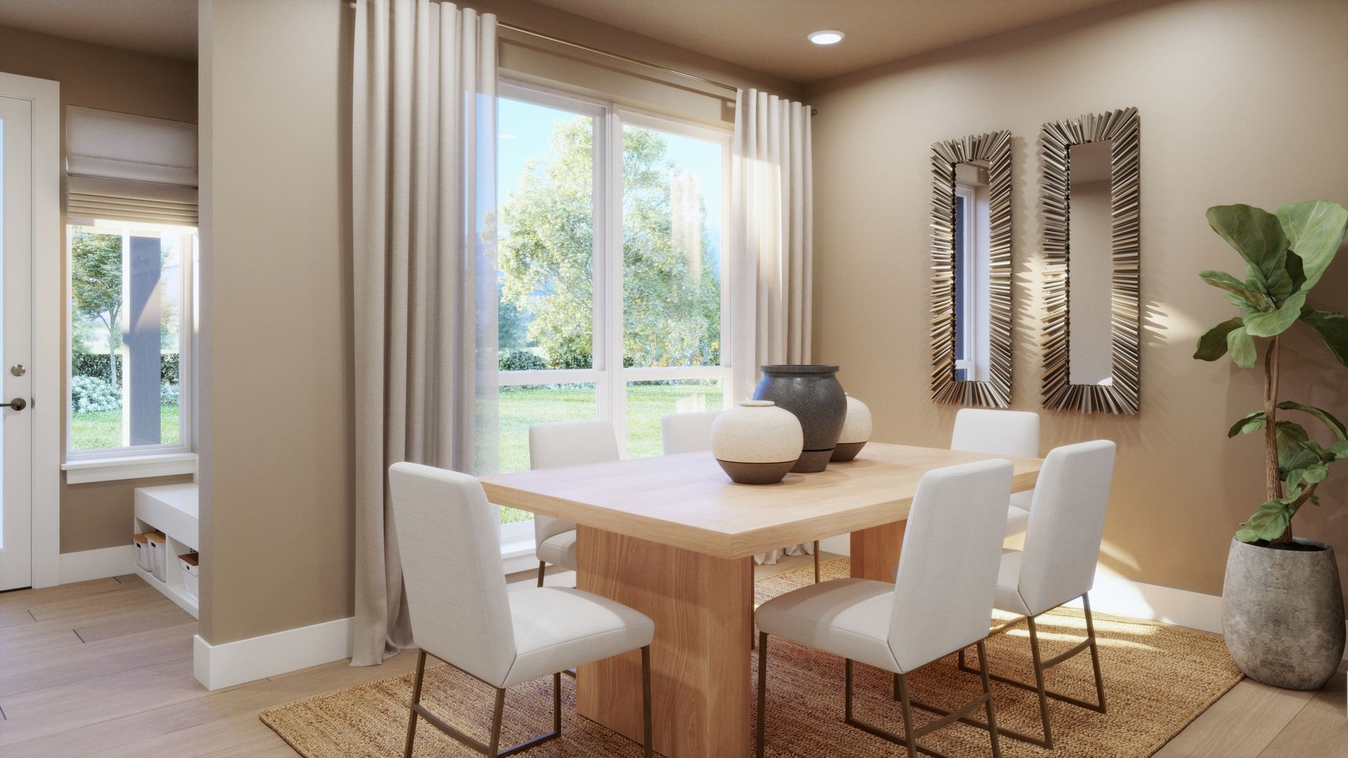 Tucked just around the corner from the kitchen, this inviting dining space offers a dedicated place to gather while maintaining an easy connection to the home’s open main-level living areas.