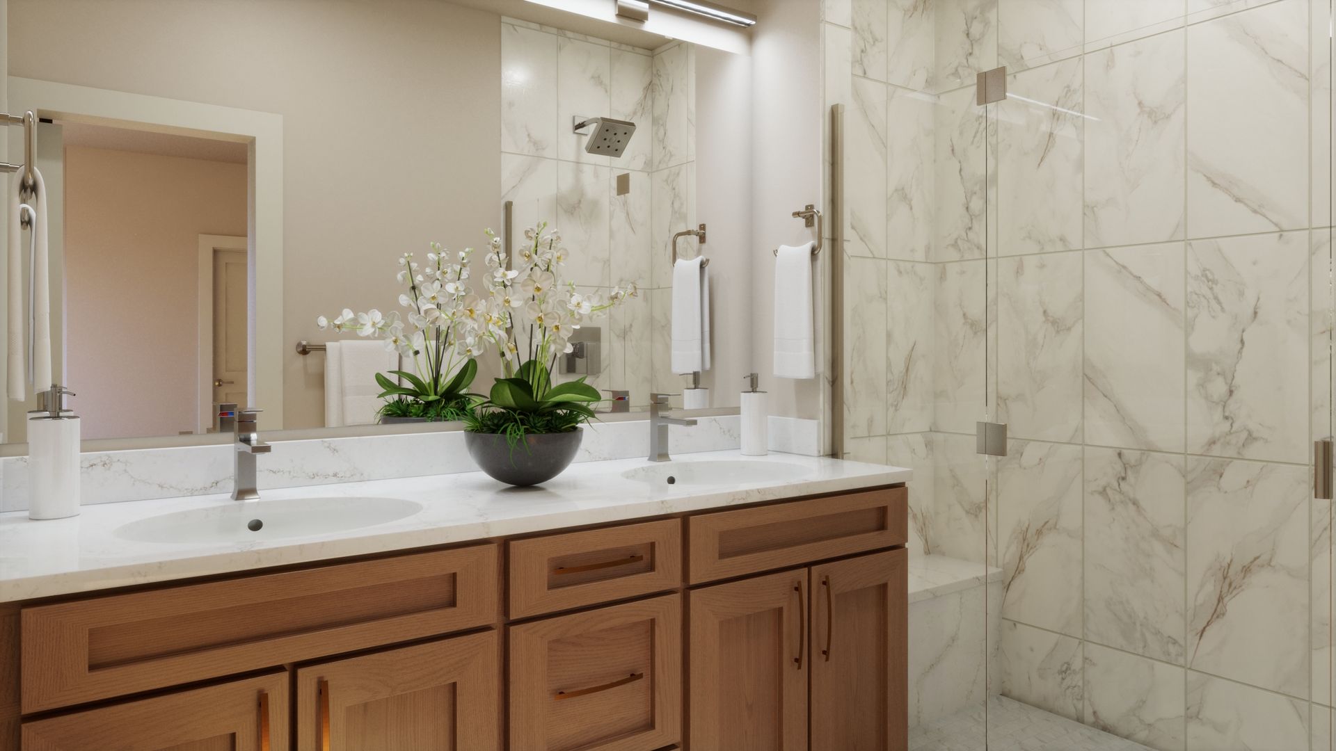 A primary bath designed with comfort and style in mind. Dual vanities, warm finishes, and a spacious walk-in shower create a polished and relaxing space for everyday living.