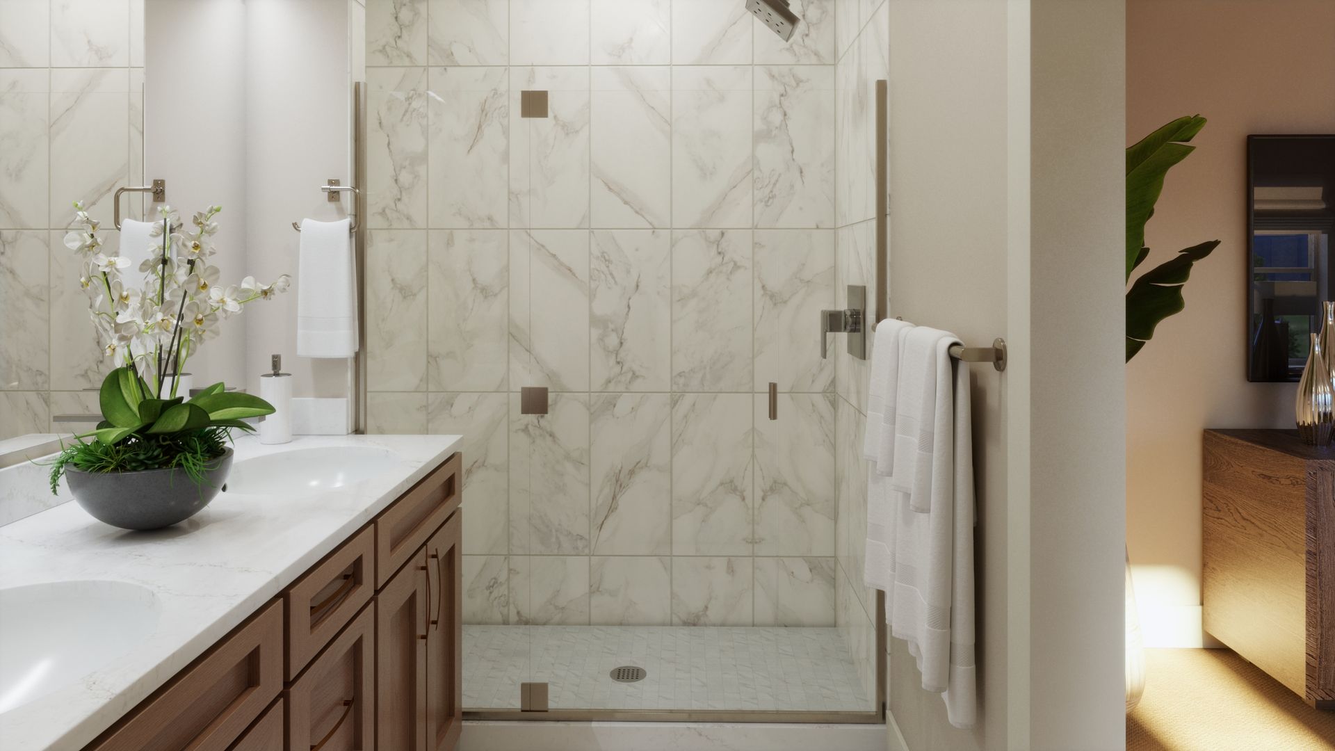 A primary bath designed with comfort and style in mind. Dual vanities, warm finishes, and a spacious walk-in shower create a polished and relaxing space for everyday living.