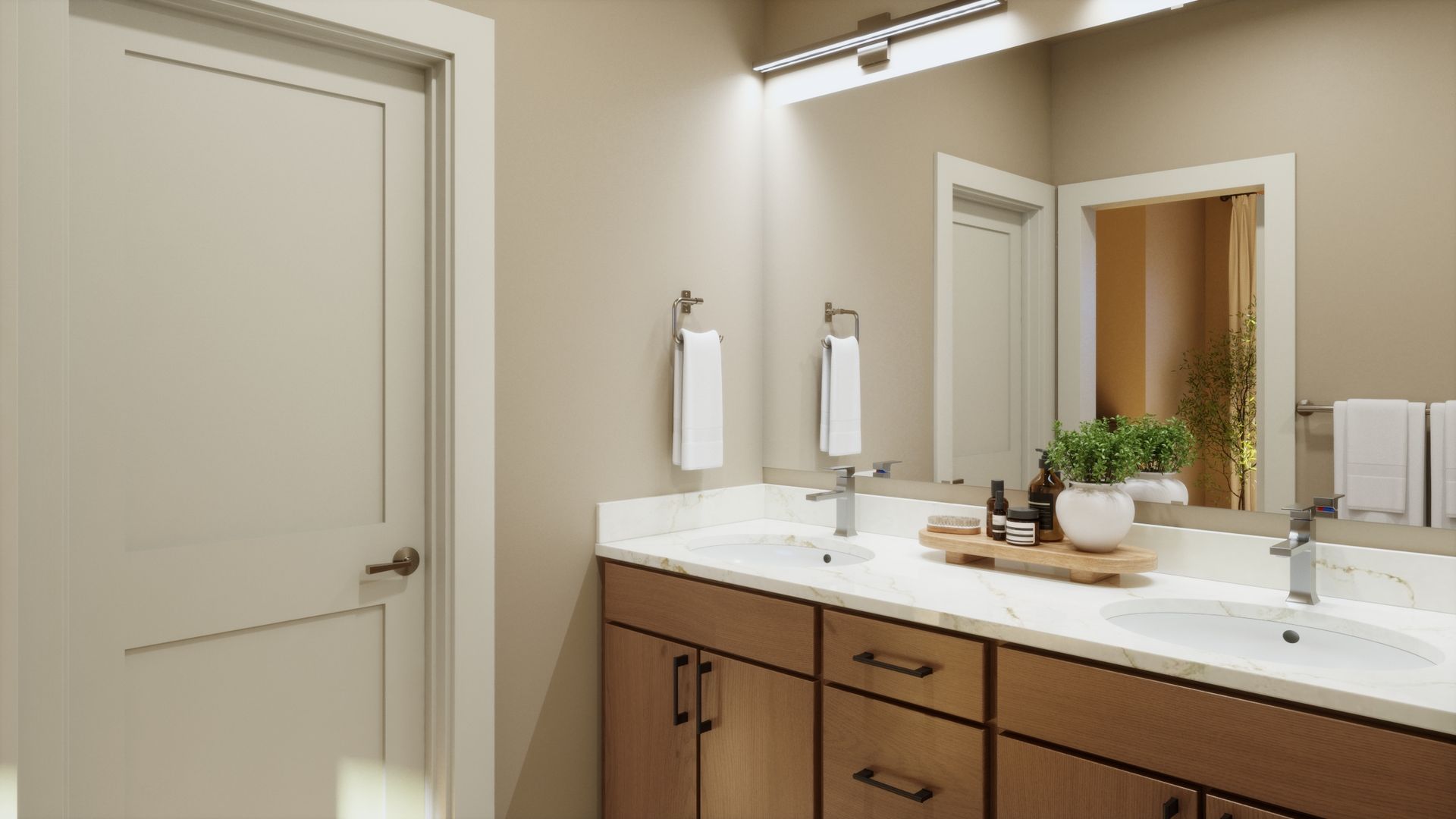 Designed for comfort and convenience, this primary bath features dual vanities, warm finishes, and a clean, modern design for a polished everyday retreat.