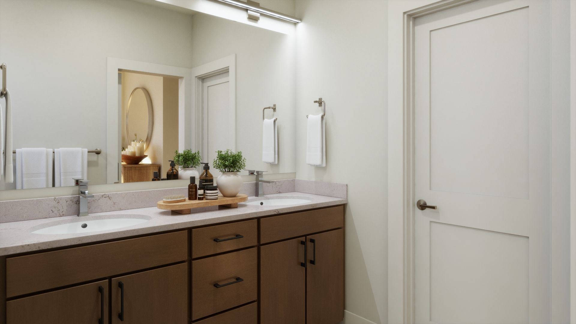 A primary bath designed for everyday comfort. Dual vanities, warm finishes, and a clean, modern design create a functional and inviting space to start and end your day.