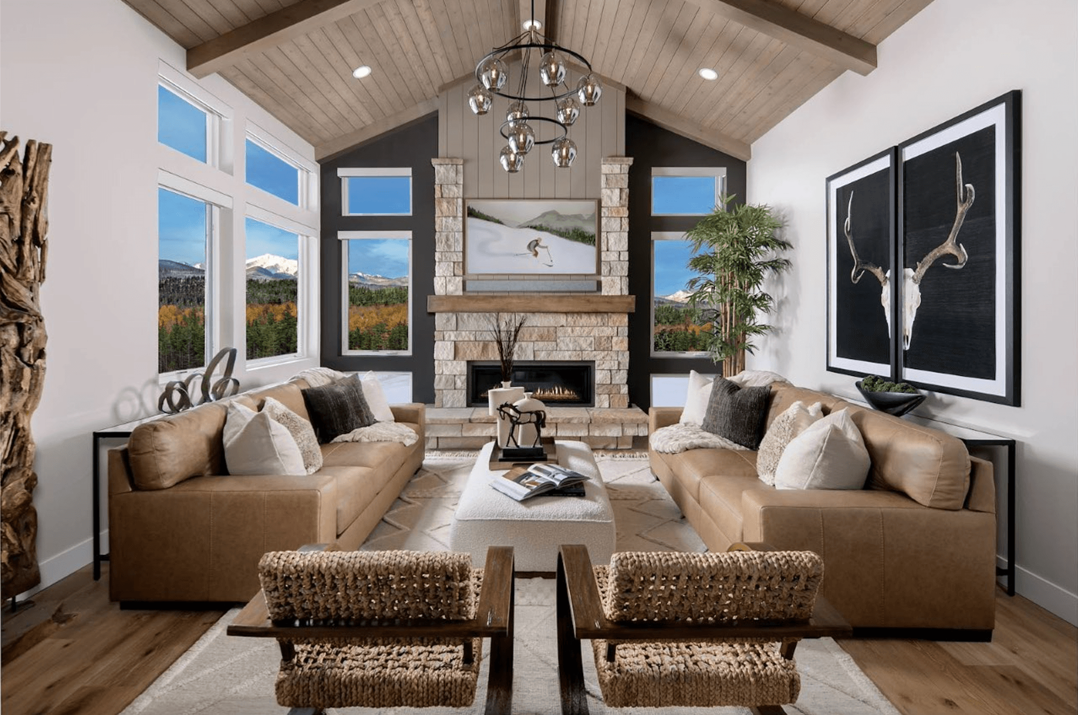 The Hummingbird offers 3 bedrooms and 3.5 baths with an optional 4th bedroom. Two family rooms and two primary suites provide flexible living, while upper and lower decks embrace the beauty of mountain living.