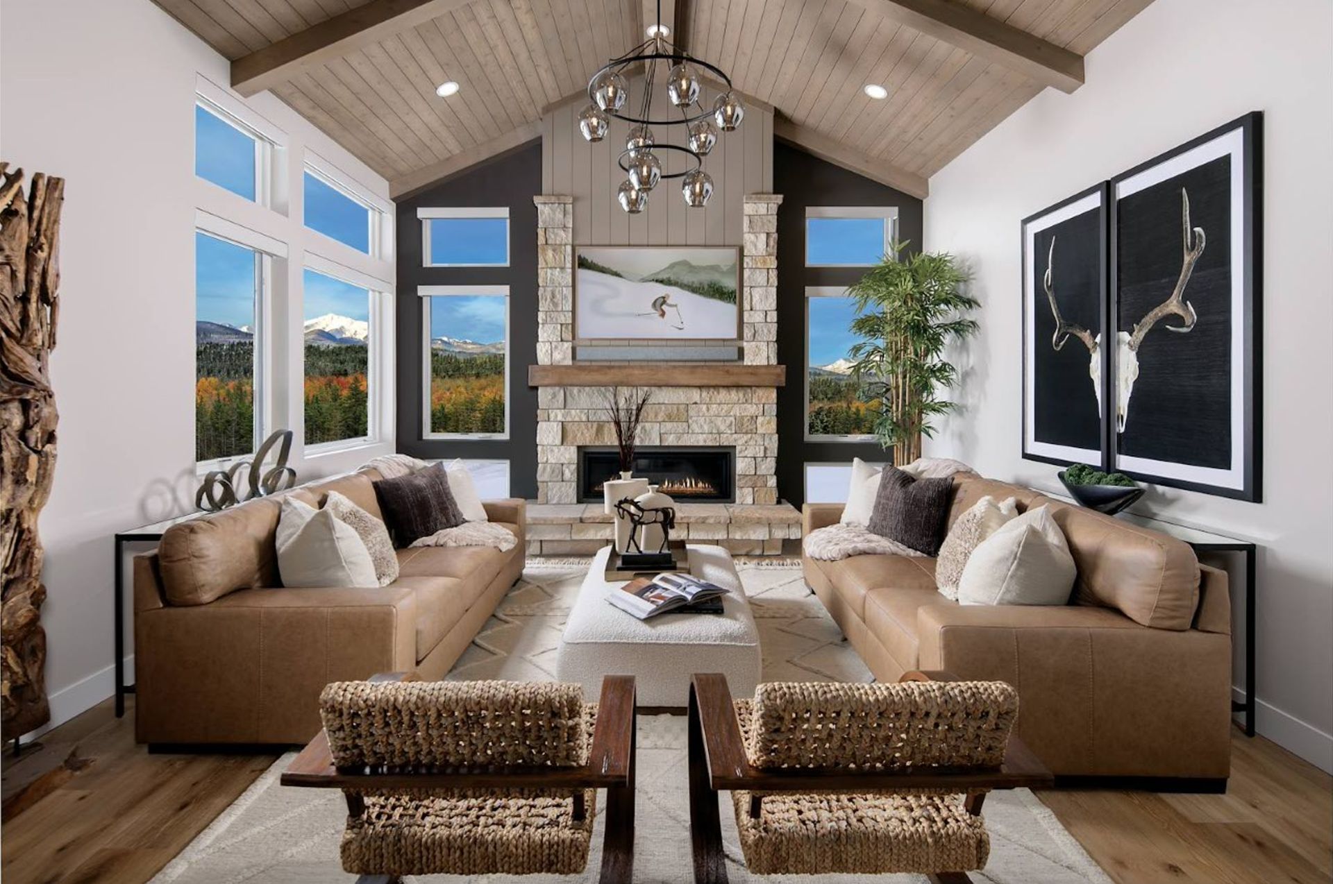 The Hummingbird offers 3 bedrooms and 3.5 baths with an optional 4th bedroom. Two family rooms and two primary suites provide flexible living, while upper and lower decks embrace the beauty of mountain living.