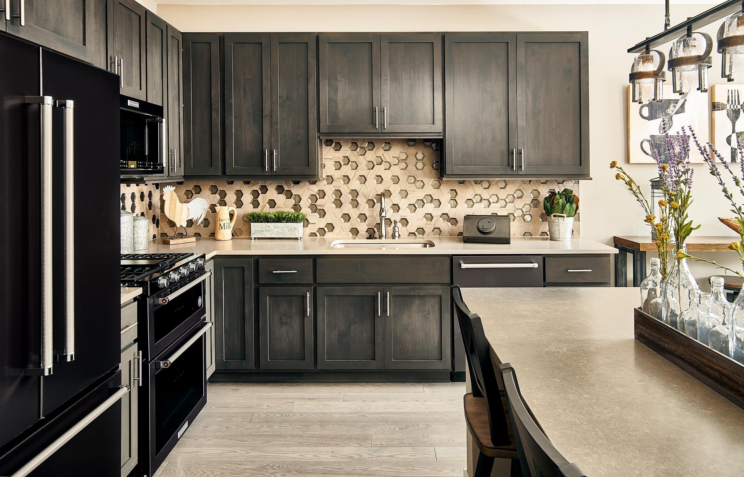 Large L shaped kitchen with KitchenAid stainless steel appliances; or upgrade to black stainless steel