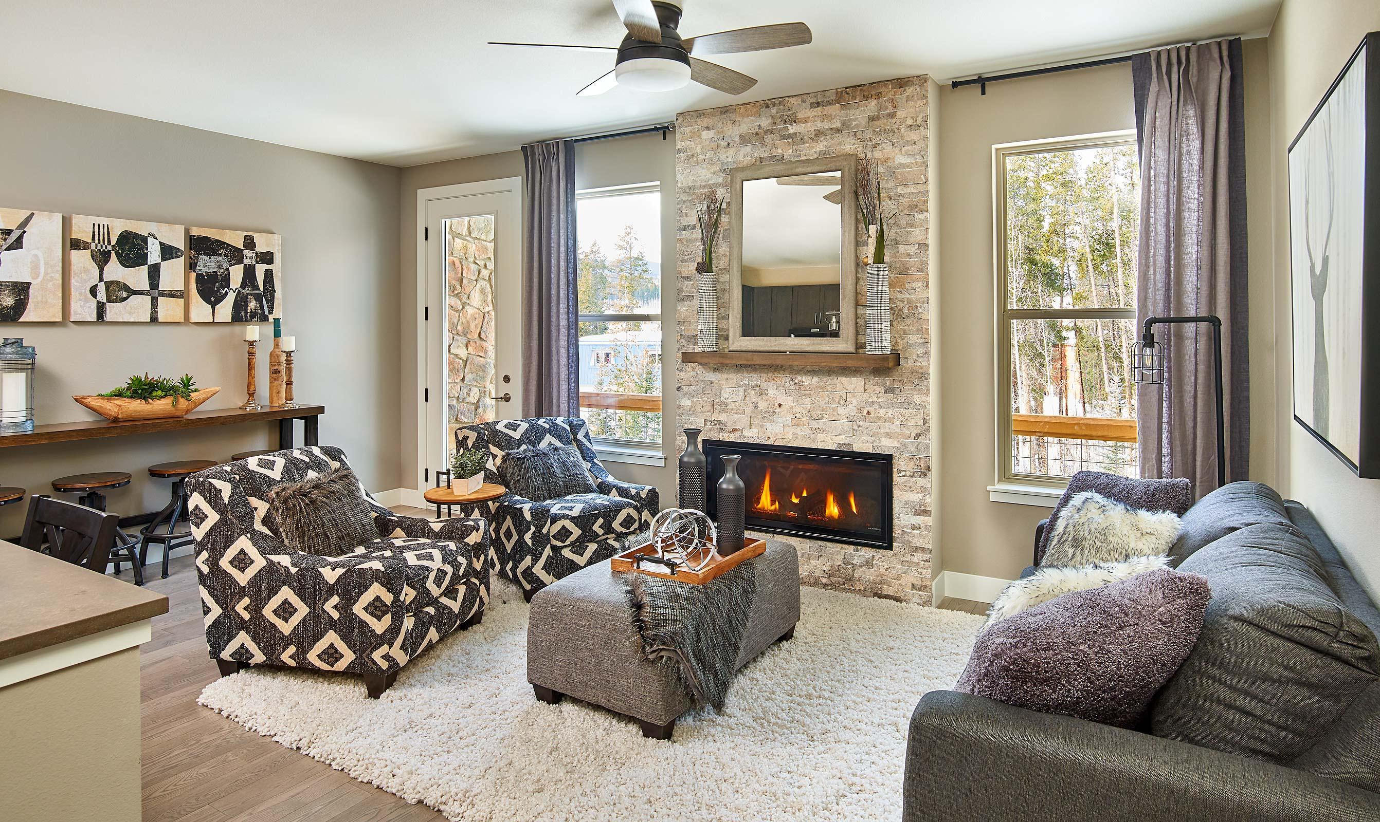 The great room has a modern fireplace