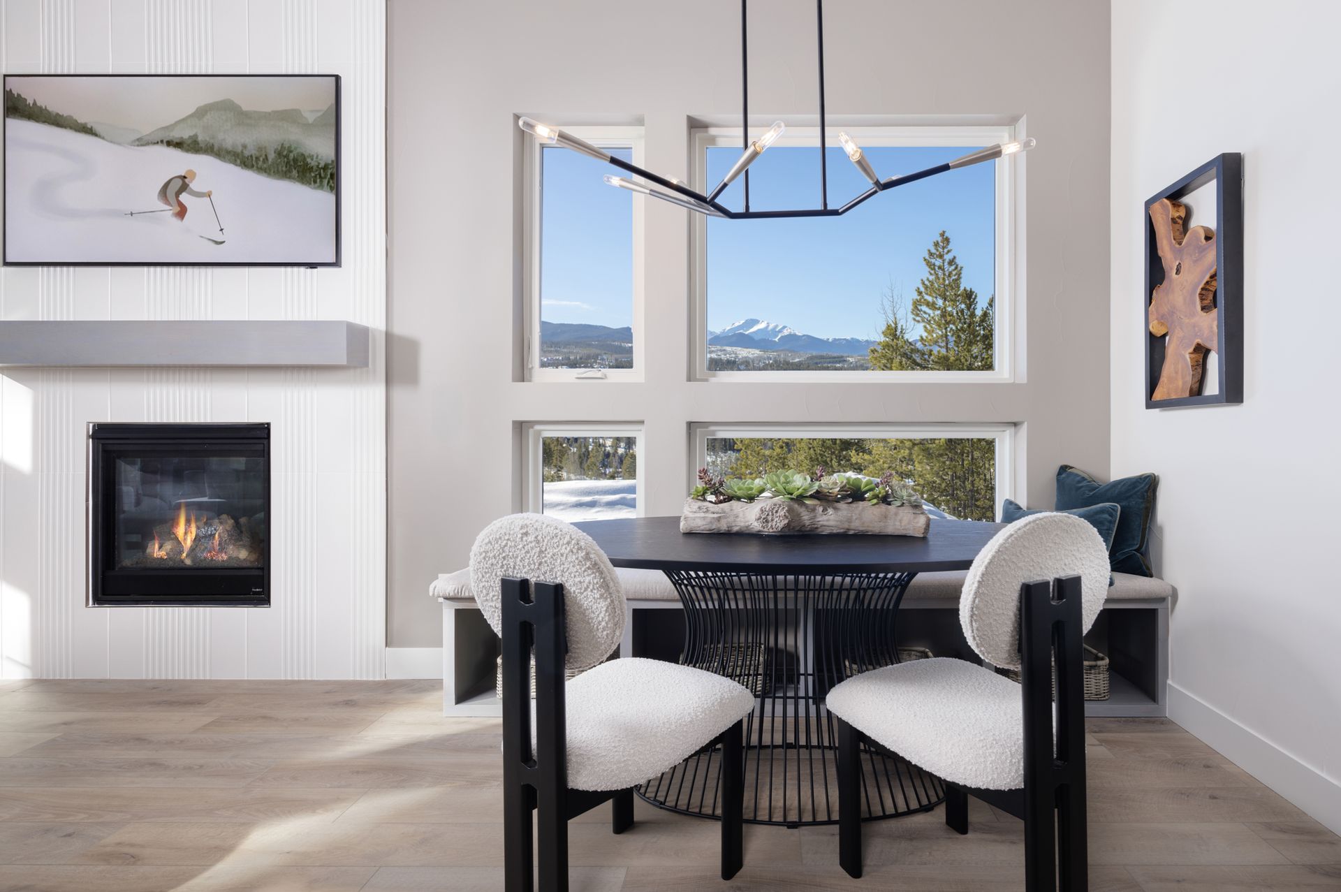 The dining space offers a warm and inviting setting, featuring a built-in bench that adds both style and functionality. Perfectly designed for gatherings, it creates a cozy spot for meals, conversation, and everyday living.