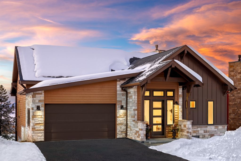 The Hummingbird offers 3 bedrooms and 3.5 baths with an optional 4th bedroom. Two family rooms and two primary suites provide flexible living, while upper and lower decks embrace the beauty of mountain living.