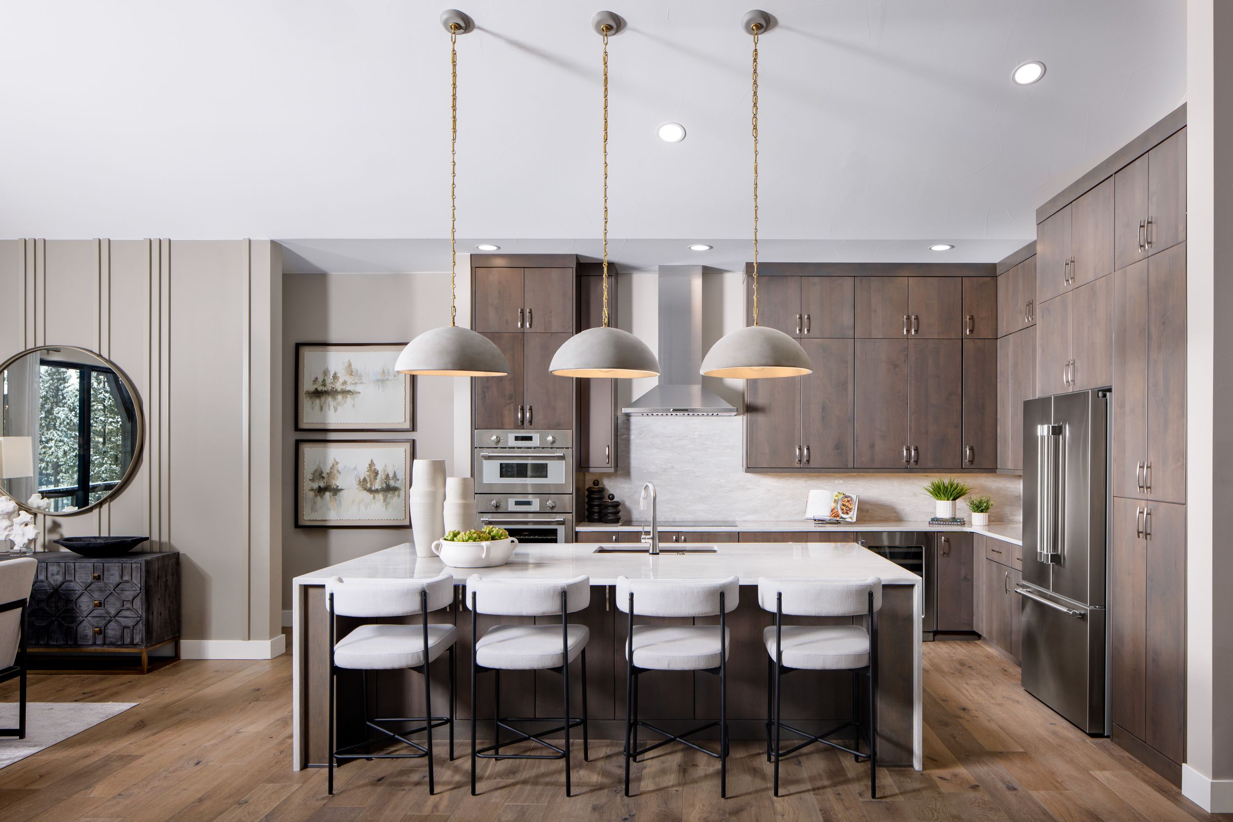 The Osprey kitchen features a massive waterfall island, abundant cabinet space, and premium Thermador appliances. Designed for both style and function, it’s the perfect centerpiece for cooking, gathering, and entertaining in the heart of the home.